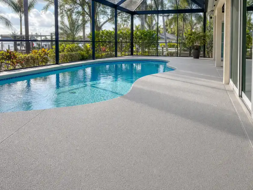 Slip-resistant pool deck coating around a screened lanai in Clearwater, Florida