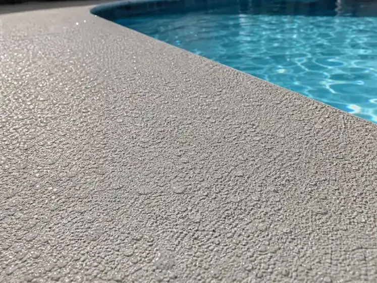 Pool deck coating installation process showing textured finish